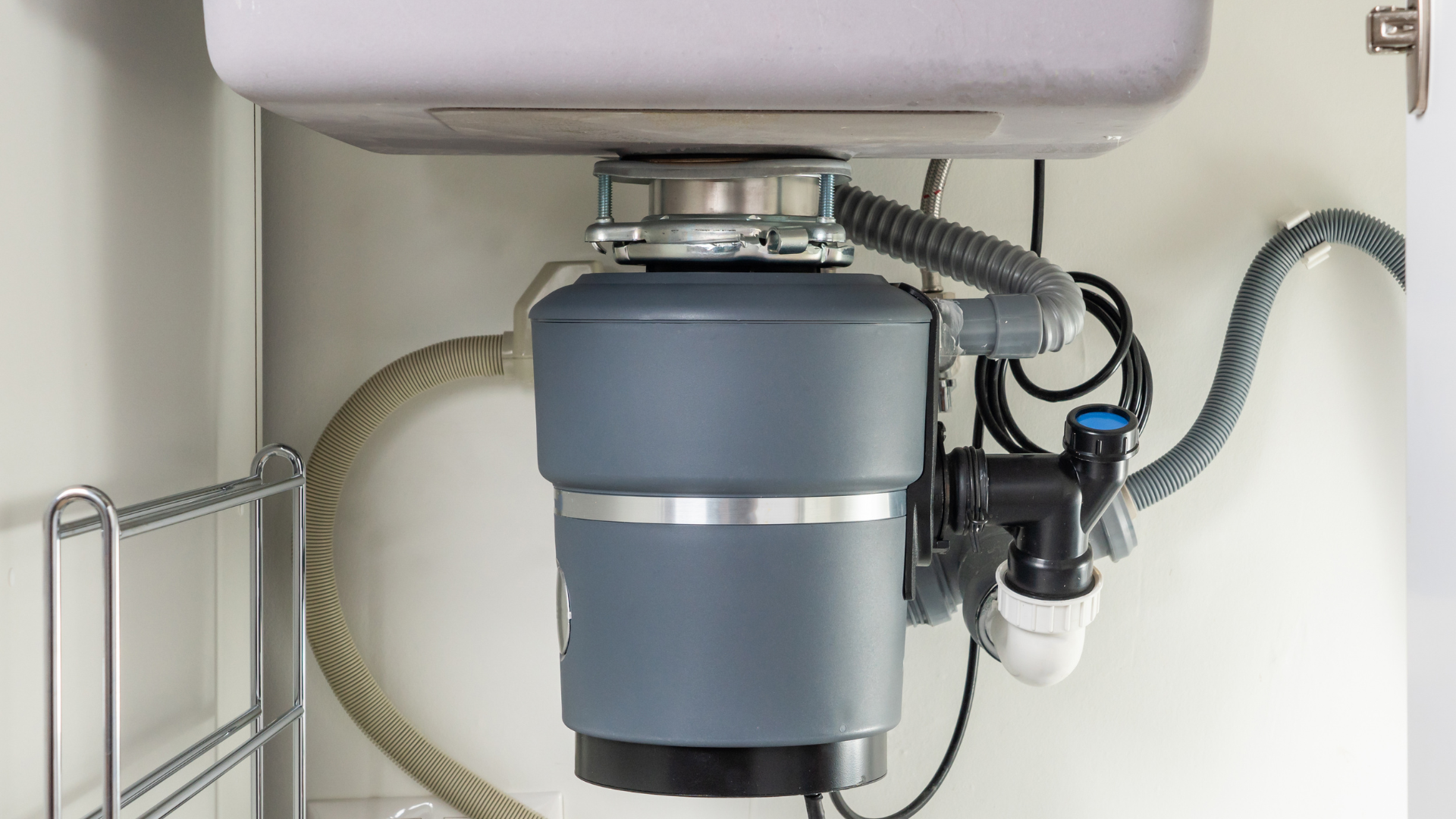Garbage Disposal Repair — professional plumber at work