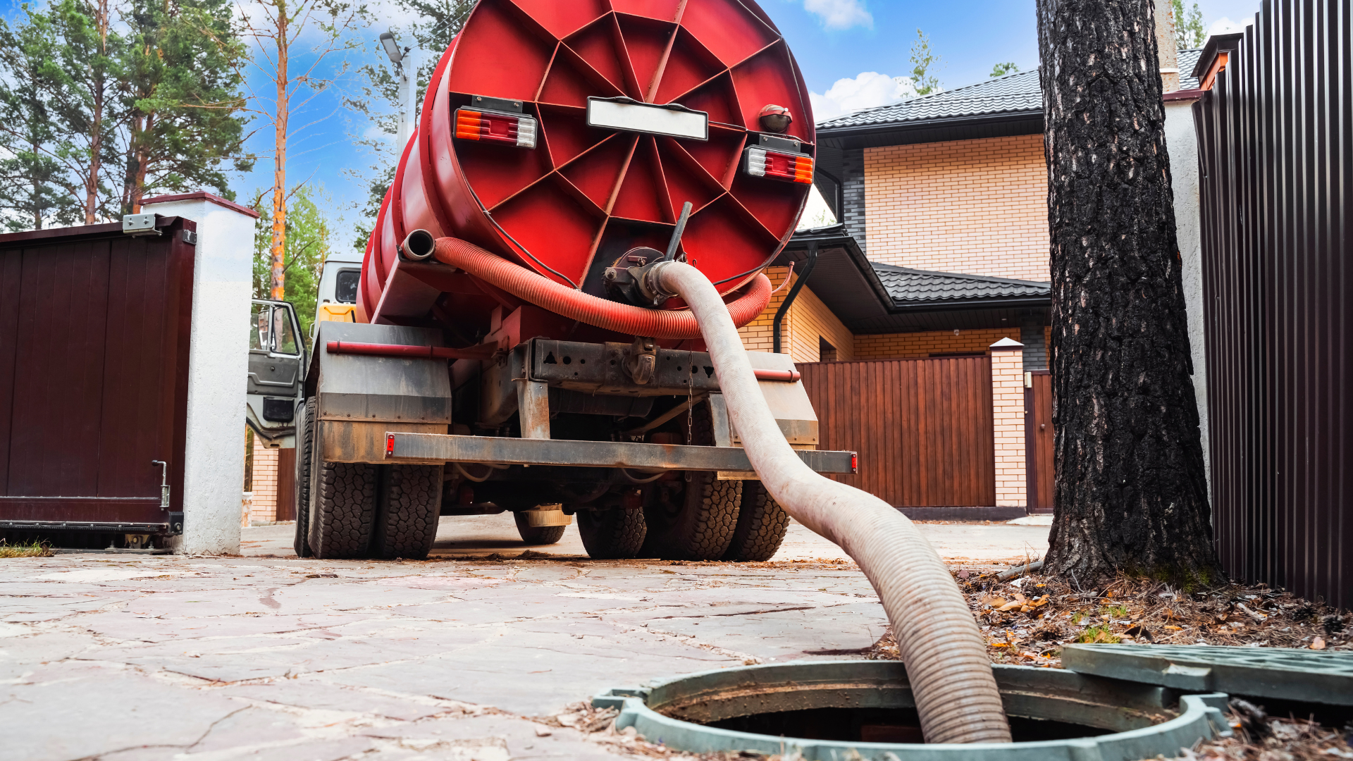 Septic Tank Pumping — professional plumber at work