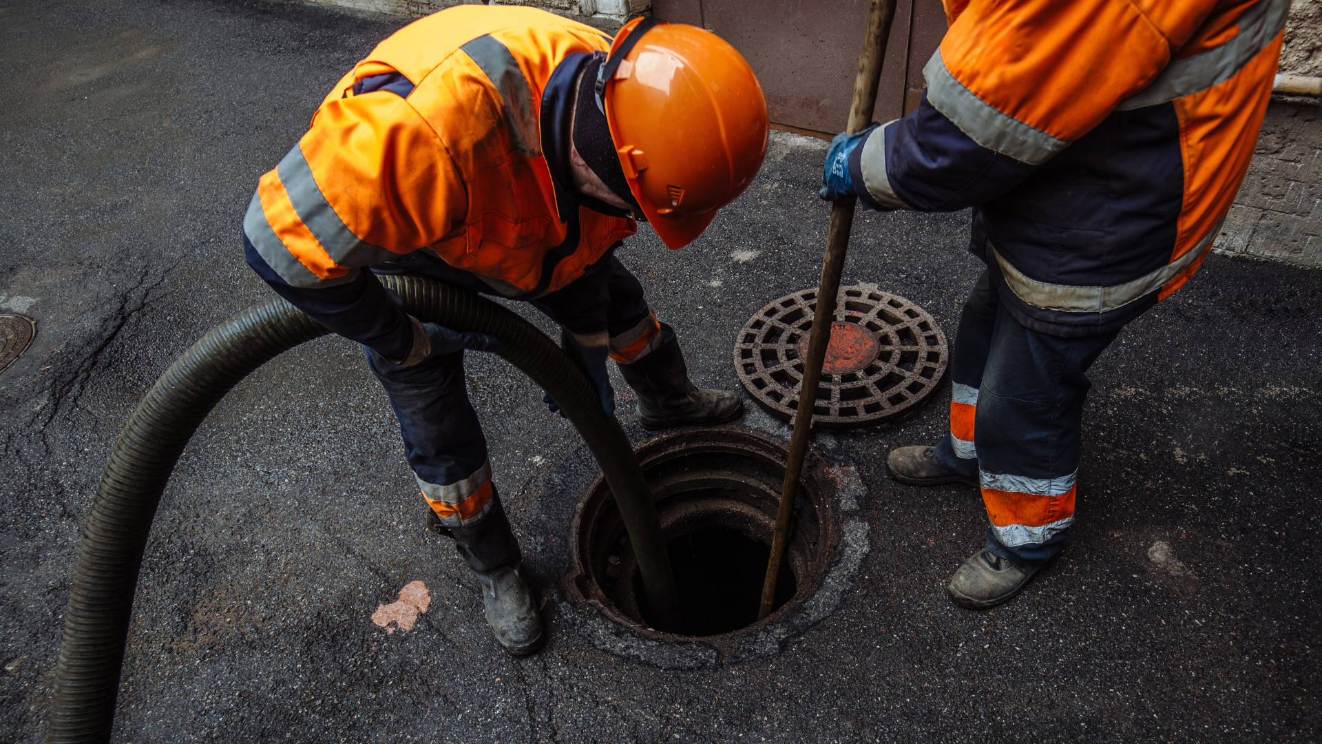 Sewer Cleaning — professional plumber at work