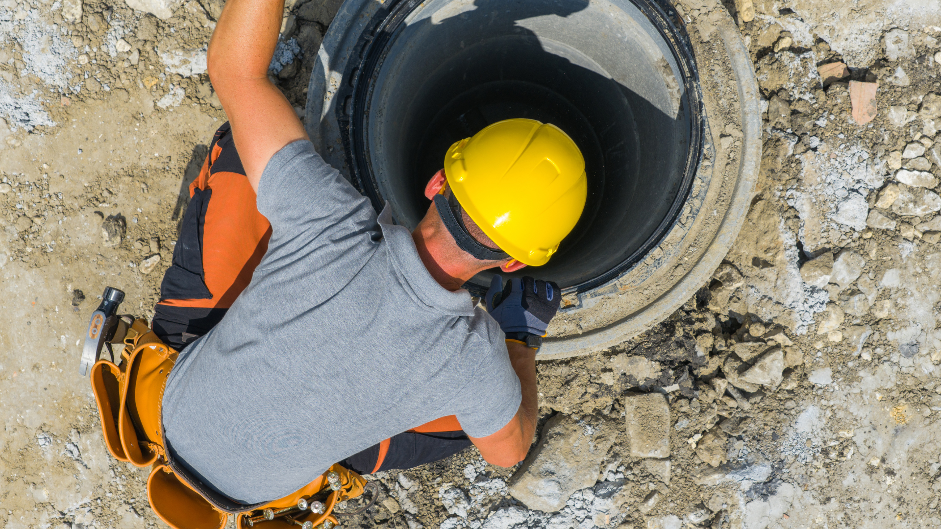 Sewer Line Inspection — professional plumber at work