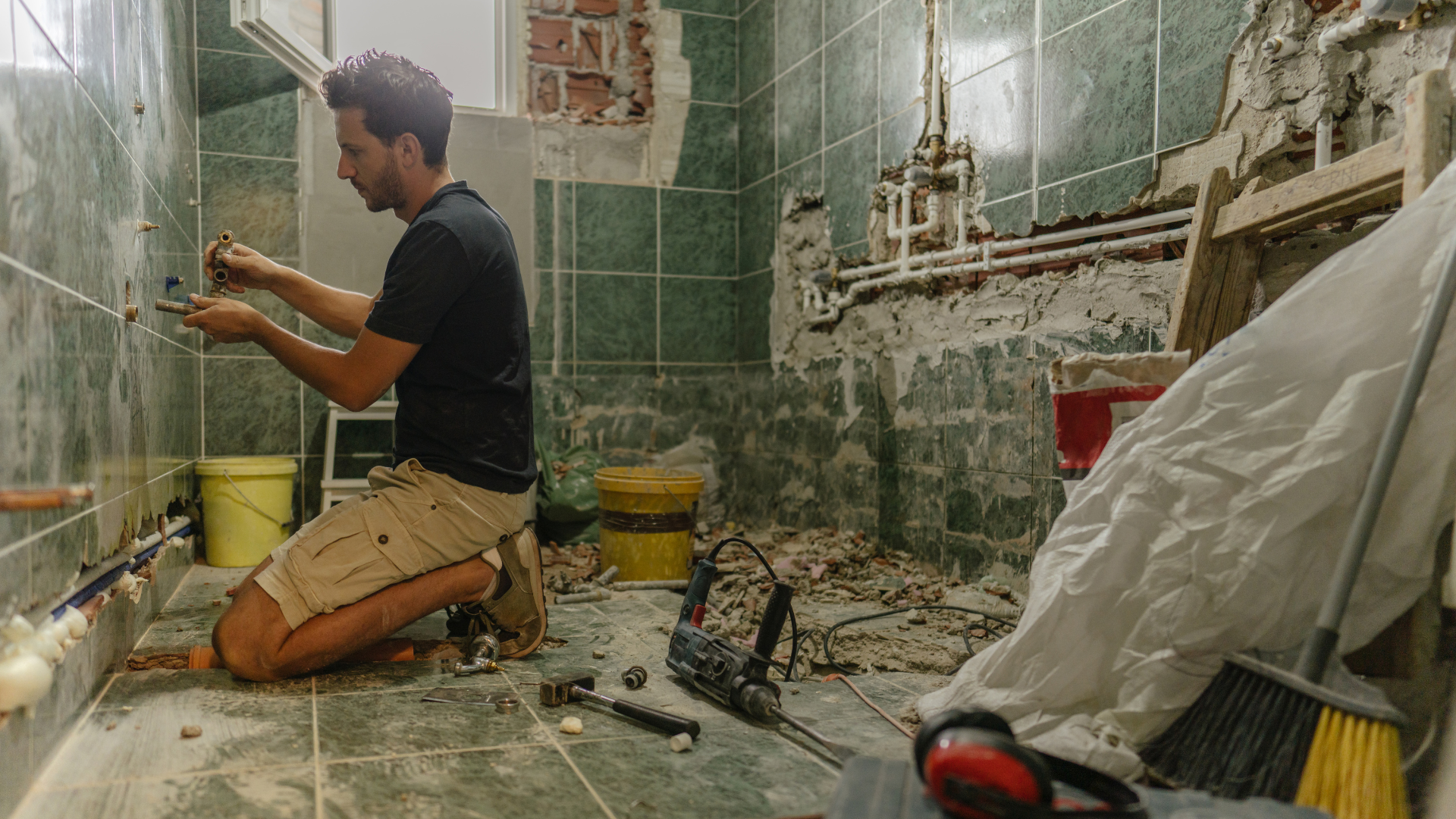 Bathroom Remodel Plumbing — professional plumber at work