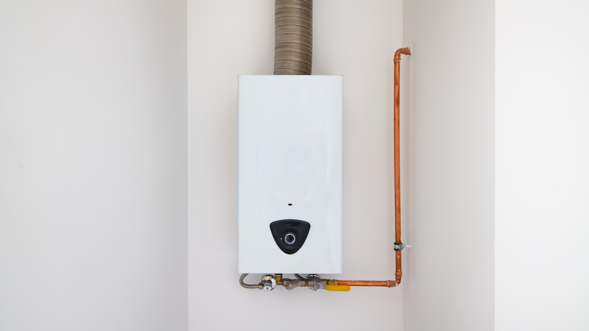 Tankless Water Heater Installation — professional plumber at work