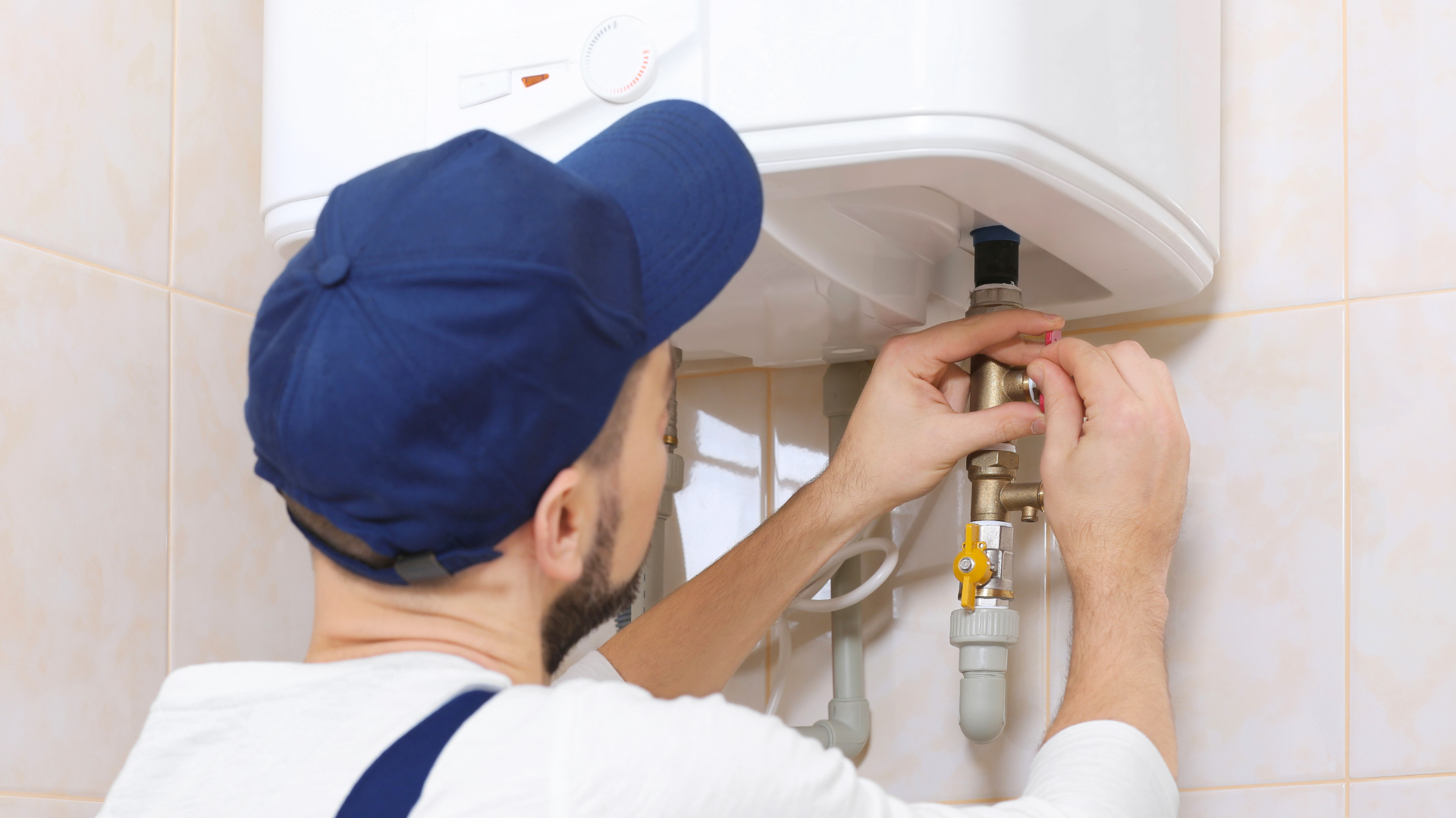 Tankless Water Heater Repair — professional plumber at work